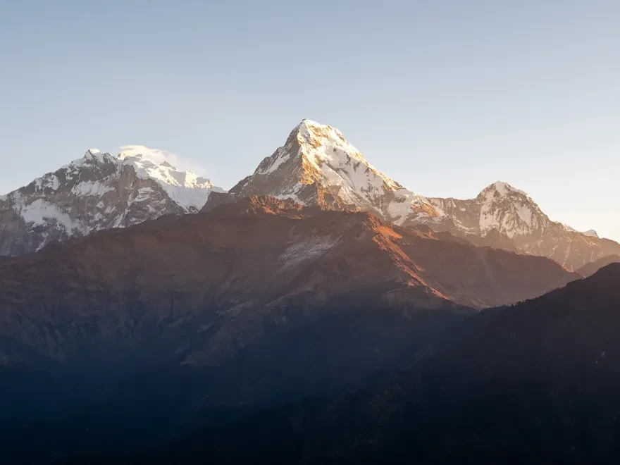 Golden sun rays over the Annapurna range during the Poon Hill Trek.