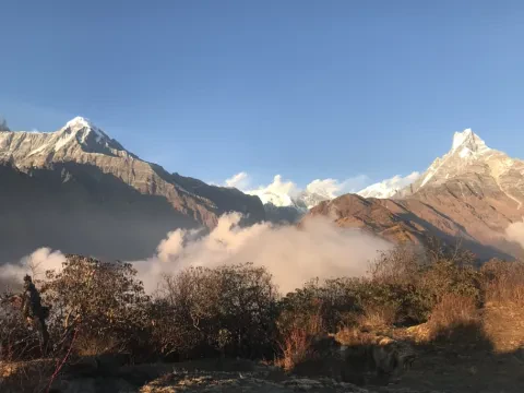 Himalayan mountains with light clouds along the Mardi Himal Trek.