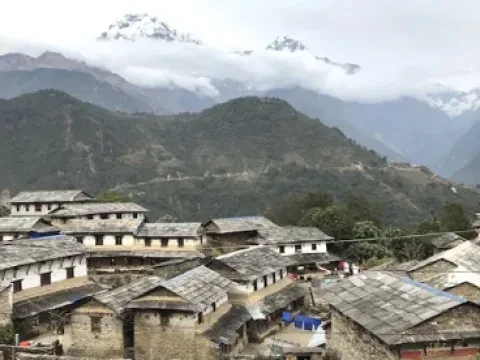Traditional Ghandruk village surrounded by Himalayan mountains along the Annapurna Base Camp Trek in Nepal.