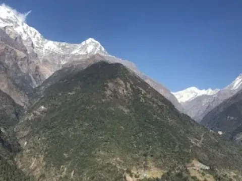 Panoramic Himalayan mountain views from Chhomrong village on the Annapurna Base Camp Trek in Nepal.