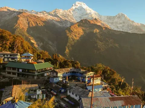 Tadapani village surrounded by Himalayan mountains in Nepal.