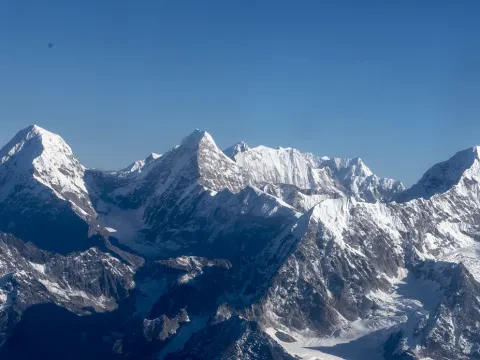 anoramic view of the snow-covered Himalayan range during an Everest mountain flight from Kathmandu, Nepal.
