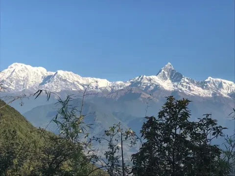 Mount Fishtail Machhapuchhre and surrounding Himalayan mountains viewed from Sarangkot, Nepal.
