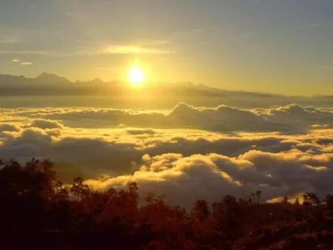 Golden sunrise over a sea of clouds with Himalayan mountain views from Nagarkot, Nepal