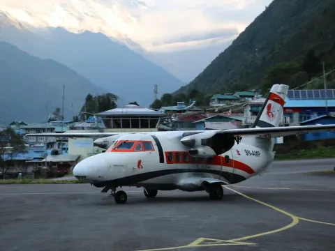 Lukla Airport with airplane in the Everest region of Nepal.