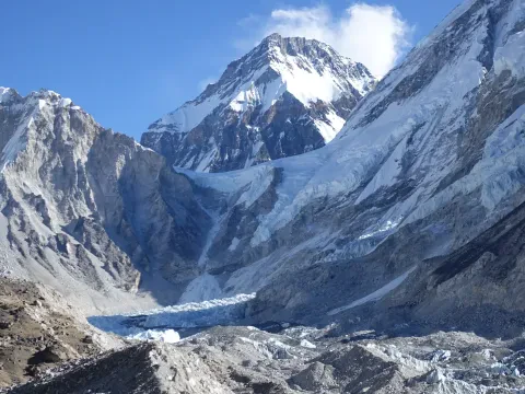Aerial view of Everest Base Camp and surrounding Himalayan mountains from a helicopter.