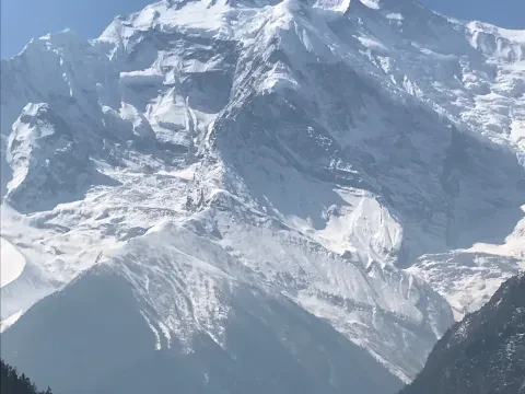 Annapurna II with a human face-like shape in the middle of the mountain.