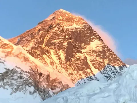 Mount Everest towering above the Himalayan landscape in Nepal.
