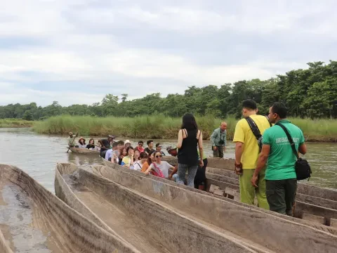 Traditional wooden canoe ready for a jungle safari ride on the Rapti River in Chitwan, Nepal.