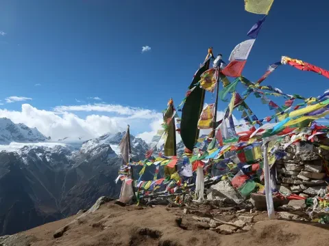 Tserko Ri prayer flags with mountain views in Langtang.