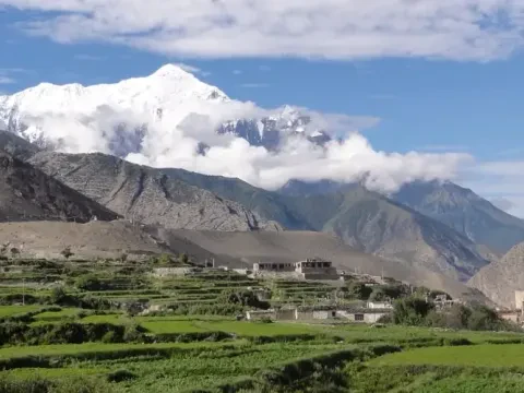 Traditional Kagbeni village with a view of snow-capped Tilicho Peak in the Annapurna region of Nepal.