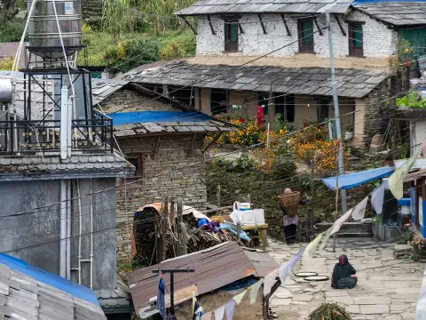 Ghandruk village life with traditional homes and Himalayan scenery.