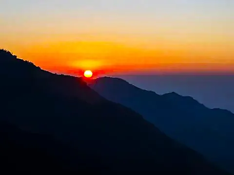 Golden sunrise over the Himalayan mountain range from Poon Hill .