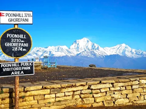 Poon Hill viewpoint with panoramic Himalayan mountain scenery.