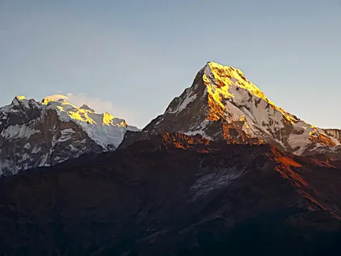 Golden sunrise illuminating Annapurna South.