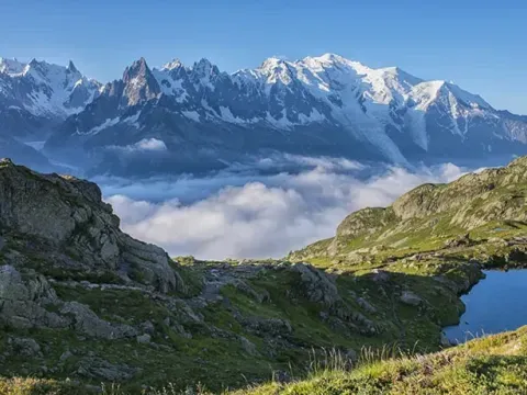 Mountain lake surrounded by alpine pasture in Ganesh Himal.