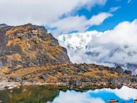 A breathtaking alpine lake surrounded by rugged mountains on the Kanchenjunga Base Camp Trek.
