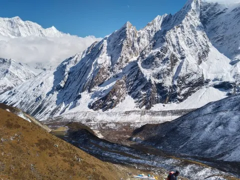 Dharamsala surrounded by rugged mountain landscape on the Manaslu Circuit Trek .