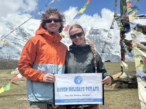 Haven Holidays guests trekking through the scenic Annapurna Circuit trail in the Manang region of Nepal.
