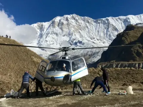 Passengers preparing to board a helicopter at Annapurna Base Camp for a flight back to Pokhara.