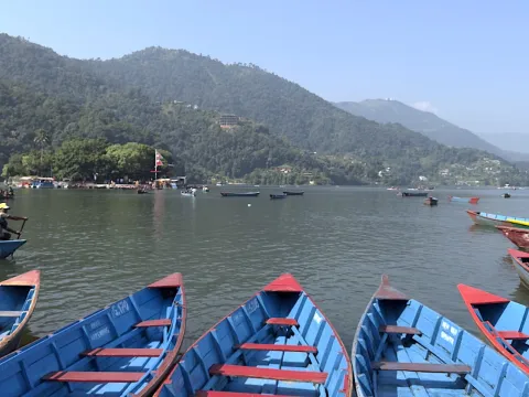 Colorful boats on Phewa Lake in Pokhara, Nepal.
