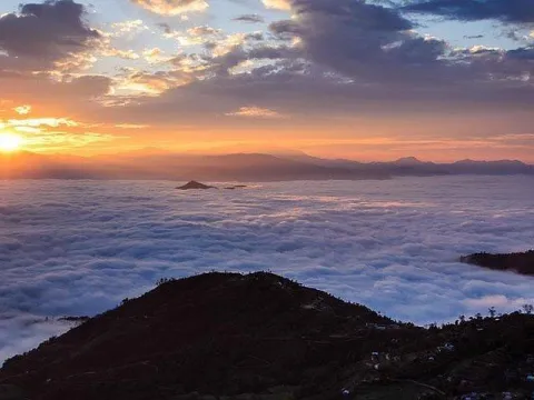 Sunrise over a sea of clouds with Himalayan mountain views from Nagarkot, Nepal.