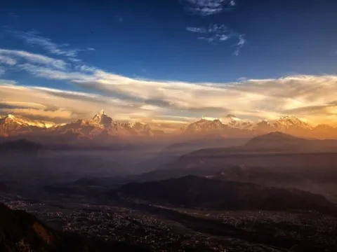 Golden sunrise over the Himalayan mountain ranges viewed from Sarangkot near Pokhara, Nepal.