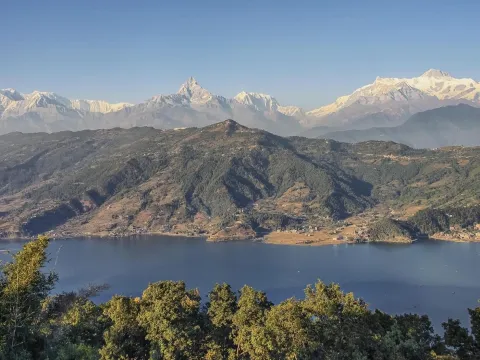 Phewa Lake in Pokhara with the Himalayan mountain range in the background, Nepal.