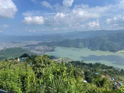 Panoramic view of Pokhara Valley from Sarangkot with surrounding hills and Himalayan mountains, Nepal.