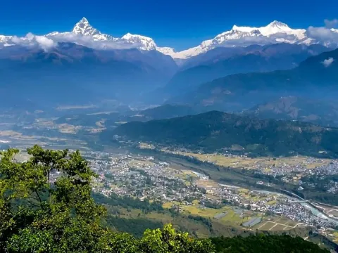 Panoramic Himalayan mountain ranges and Pokhara Valley viewed from Sarangkot, Nepal.