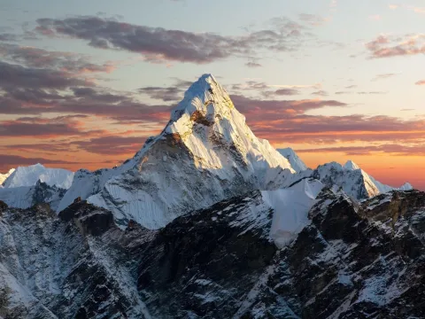 Ama Dablam glowing in golden sunrise light from Kala Patthar in the Everest region, Nepal.