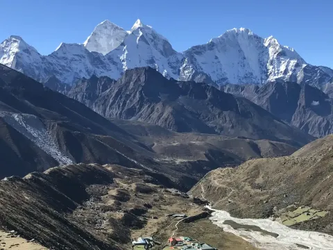 Pheriche Valley surrounded by spectacular Himalayan mountains on the Everest Base Camp Trek.