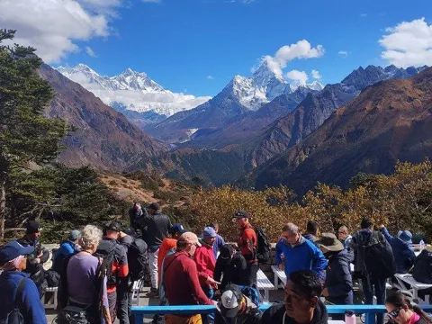 Trekker enjoying Mount Everest views from Everest View Hotel in the Khumbu region of Nepal.