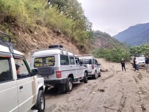 Jeep driving through the Himalayan mountain road on the Everest Base Camp Trek by land.