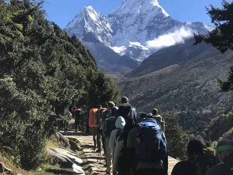 Trekkers heading to Everest Base Camp with stunning Mount Ama Dablam views in Nepal.