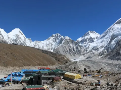 Gorak Shep village surrounded by towering Himalayan mountains on the Everest Base Camp Trek.