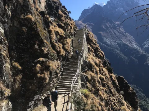 Scenic trekking trail through Gokyo Valley surrounded by Himalayan mountains in Nepal.