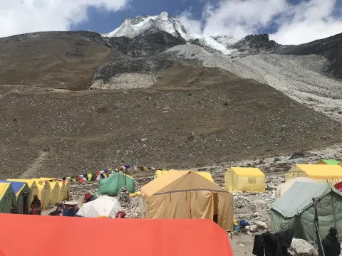 Island Peak Base Camp surrounded by snowy Himalayan mountains in Nepal.