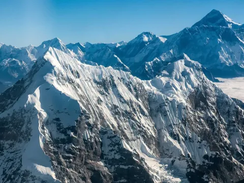 Mount Everest rising above the surrounding Himalayan peaks during an Everest mountain flight in Nepal.