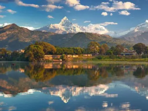 Adventure tour in Pokhara, Nepal, featuring Phewa Lake, the Annapurna Himalayan range, and scenic mountain landscapes.