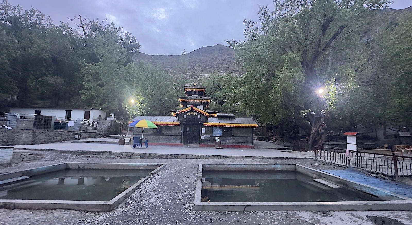 Muktinath Temple in Mustang Nepal with Hindu and Buddhist pilgrimage site, prayer flags, and Himalayan mountain backdrop