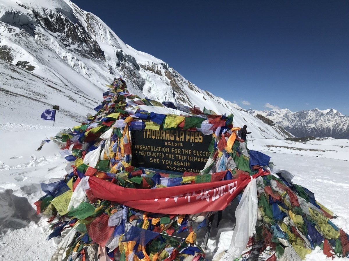 Snow-covered Thorang La Pass in winter on the Annapurna Circuit Trek Nepal Himalaya