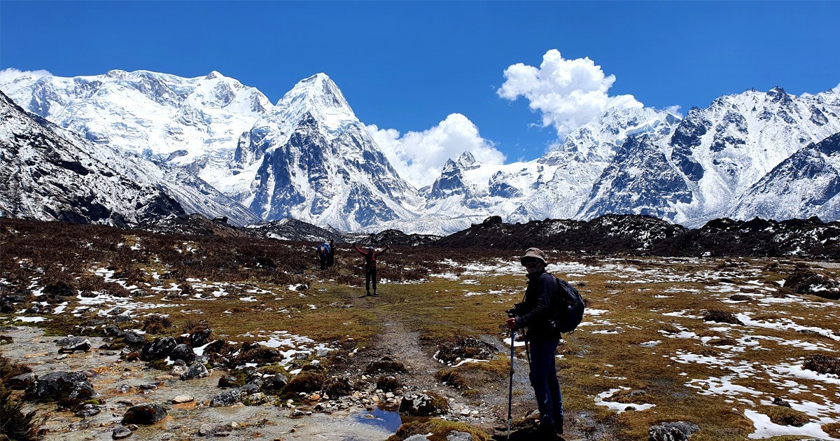 Kanchenjunga South Base Camp (Oktang) with breathtaking views of Mount Kanchenjunga's south face, Yalung Glacier, alpine meadows, and towering snow-covered Himalayan peaks.