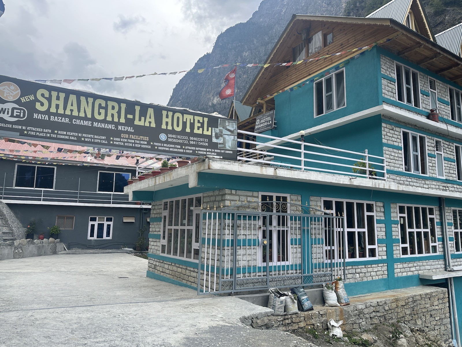 Traditional teahouse in Chame on the Annapurna Circuit Trek with cozy twin rooms, a warm wooden dining hall, mountain views, and welcoming Himalayan hospitality.