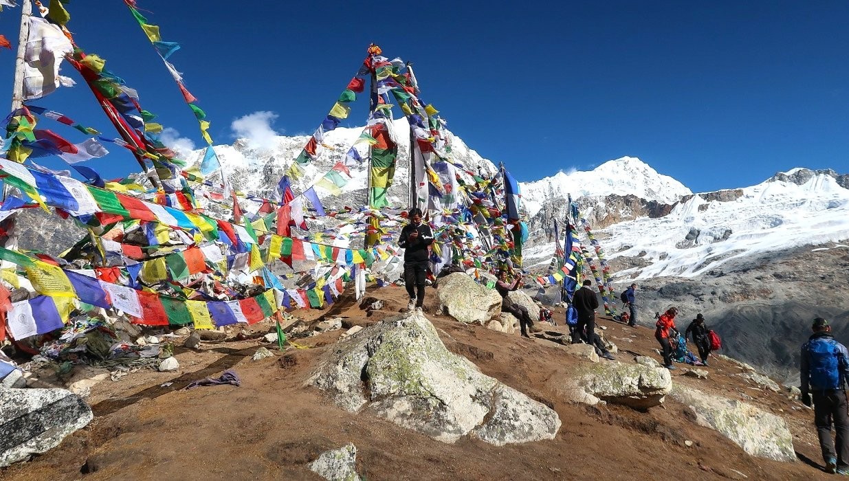 Tserko Ri viewpoint with prayer flags Langtang Valley Nepal Himalayan panorama