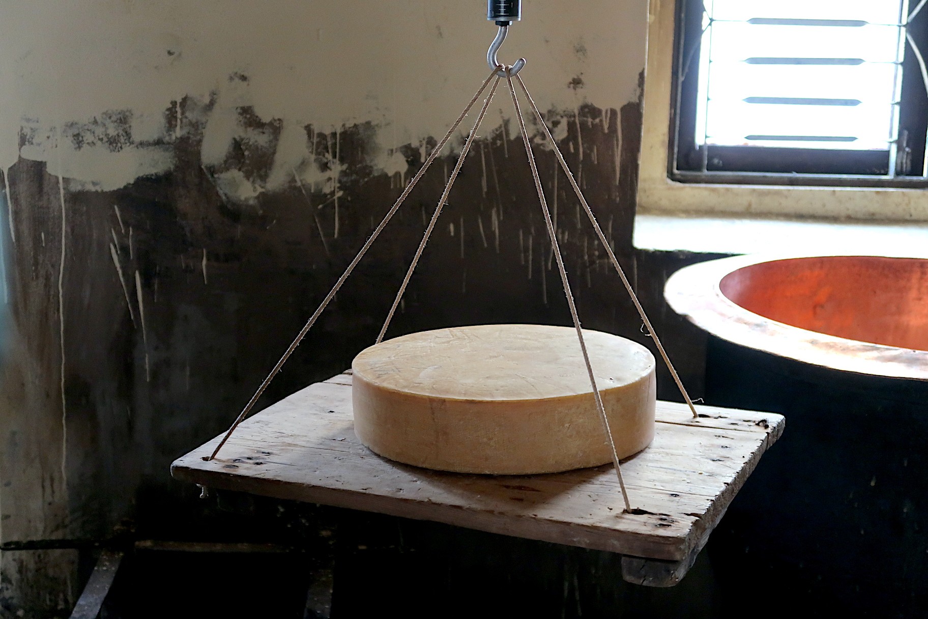 Kyanjin cheese factory in Langtang Valley showcasing traditional yak cheese production, local workers, and mountain backdrop in the Himalayan region of Nepal.