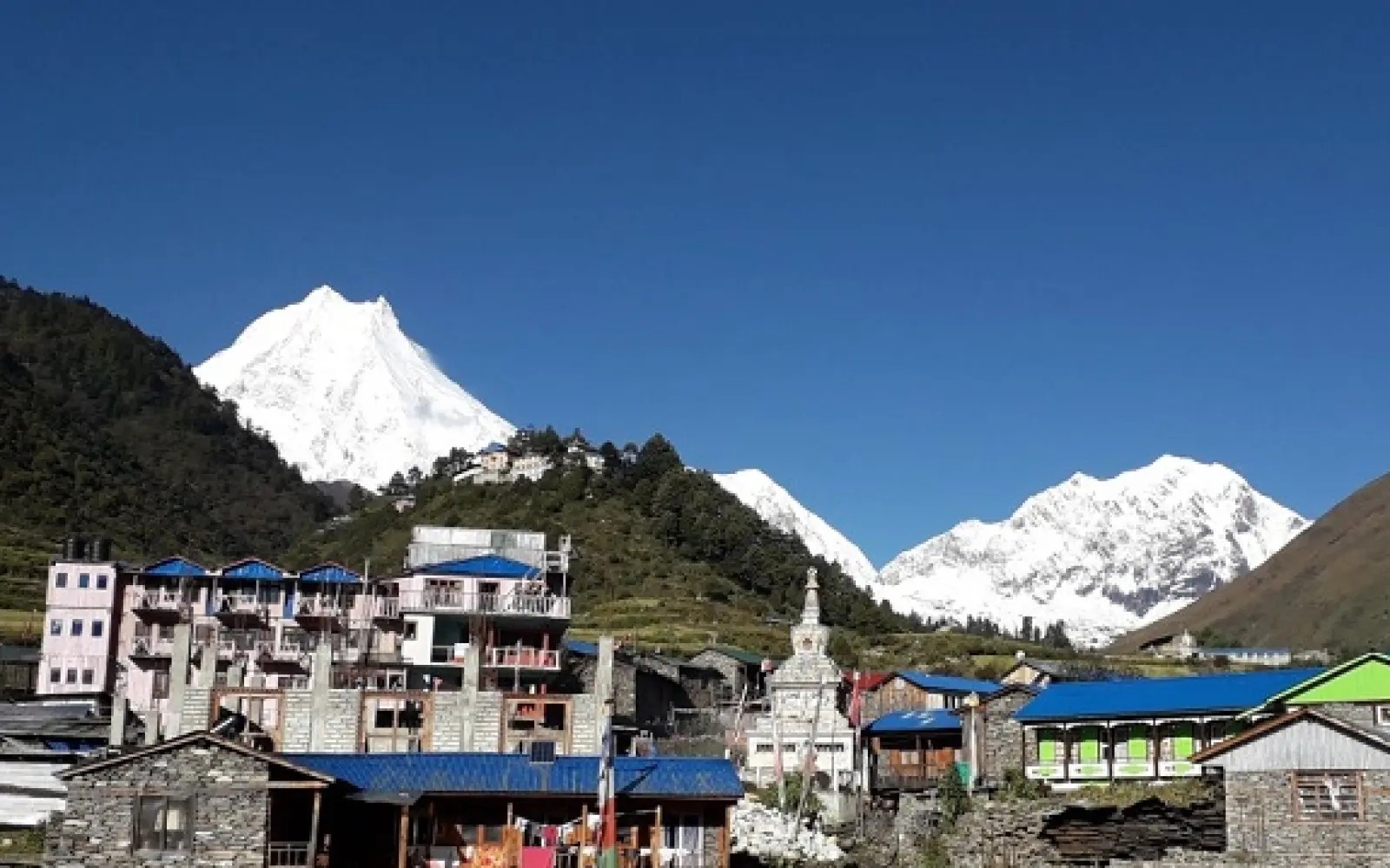 Lho Gaon with monastery and surrounding mountain peaks: