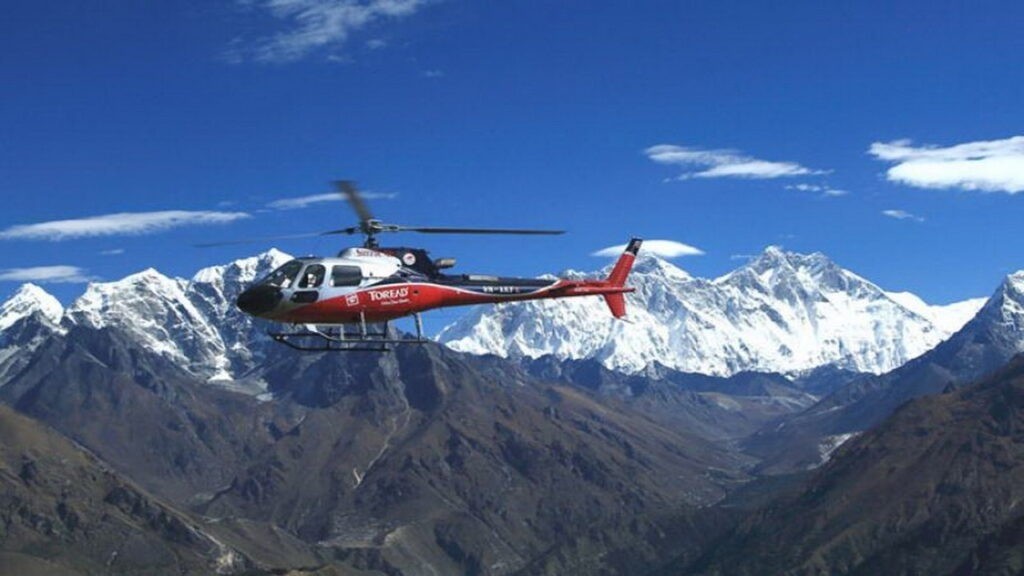 "Helicopter flying over the Everest region with aerial views of Mount Everest, Ama Dablam, Khumbu Glacier, and the Himalayan mountains in Nepal."