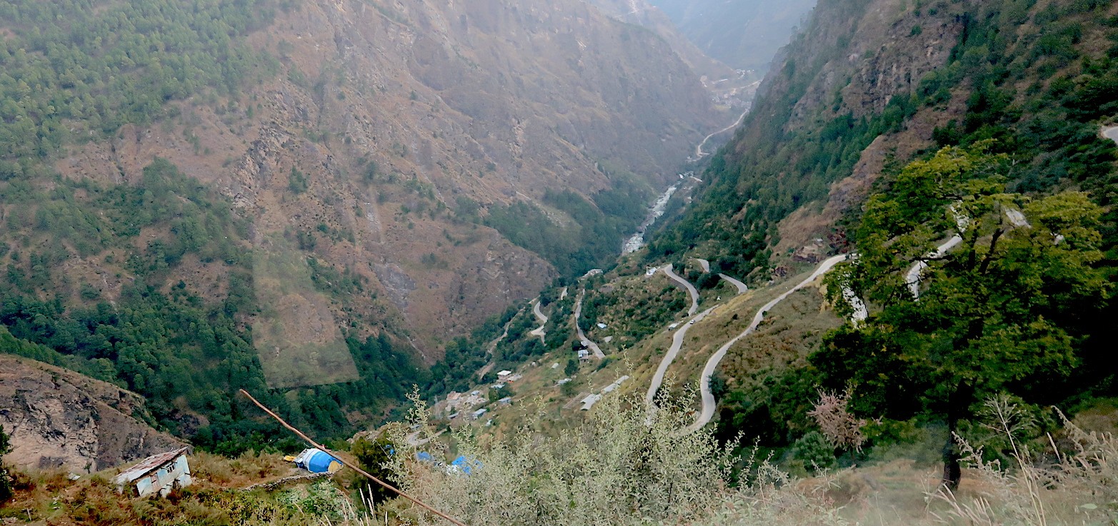 Scenic mountain road from Syabrubesi to Kathmandu featuring winding highways, green hills, river valleys, traditional villages, and breathtaking Himalayan landscapes during the return journey.