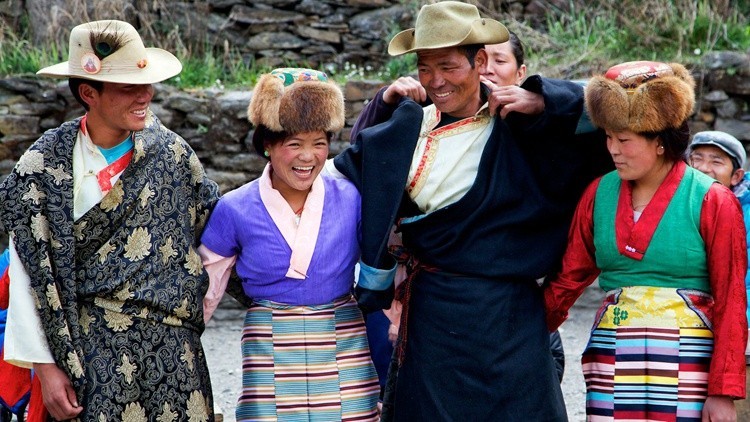 "Sherpa men and women wearing traditional Himalayan clothing in the Everest region, showcasing colorful Tibetan-inspired attire, handcrafted garments, and rich Sherpa cultural heritage in Nepal.